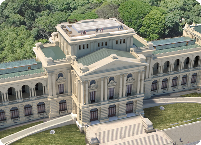 Vista aérea de edifício histórico cercado por área verde.